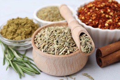 Photo of Different aromatic spices on light grey table, closeup