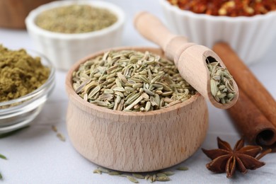 Photo of Different aromatic spices on light grey table, closeup