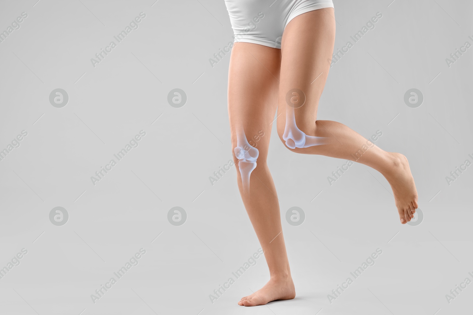 Anatomy of knee. Woman running against grey background, closeup. Illustration on her leg Image of Anatomy of knee. Woman running against grey background, closeup. Illustration on her leg