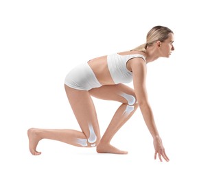 Image of Anatomy of knee. Woman in starting position for run on white background. Illustration on her legs