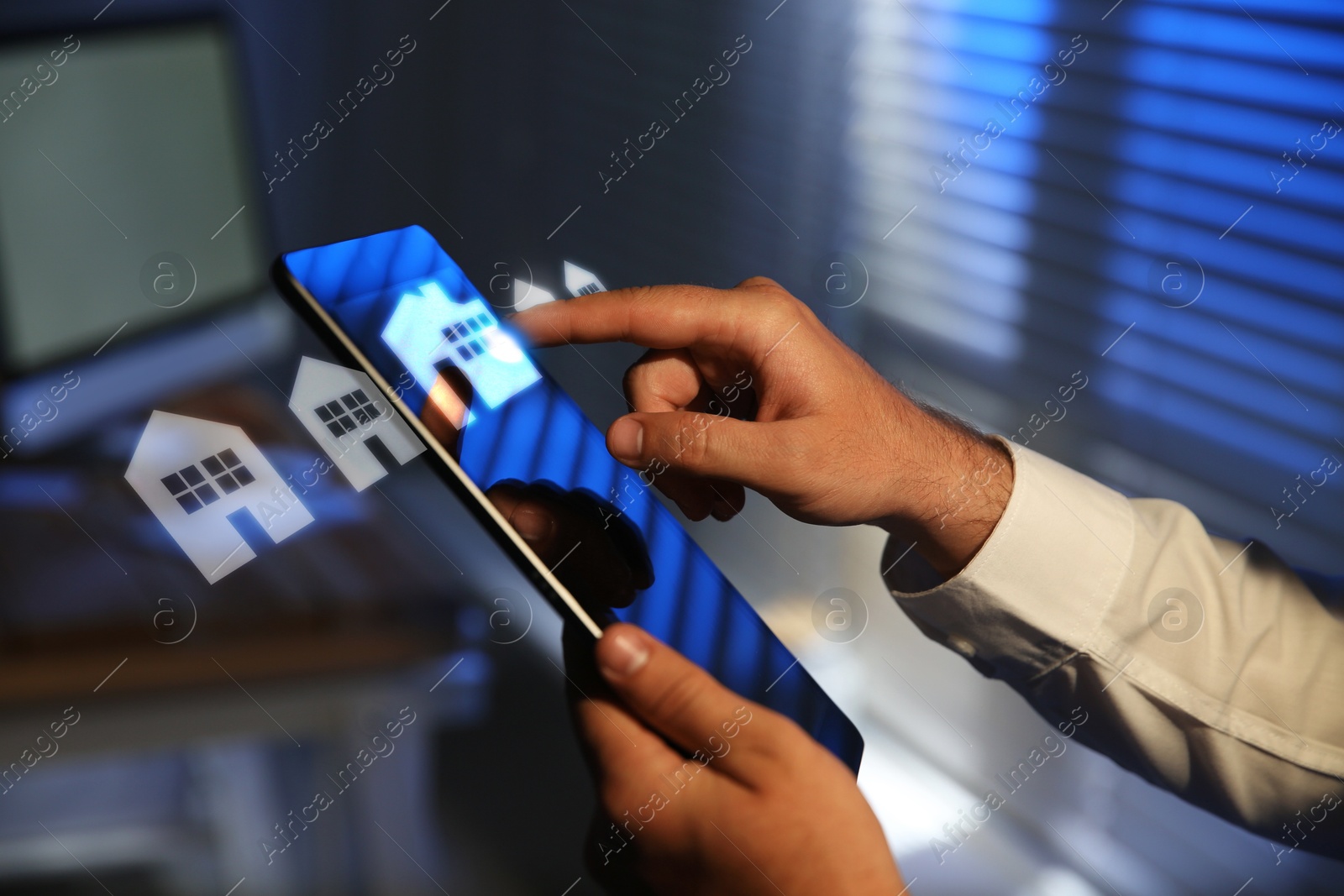 Image of Real estate agent touching house icon on tablet screen indoors, closeup. Search for apartment