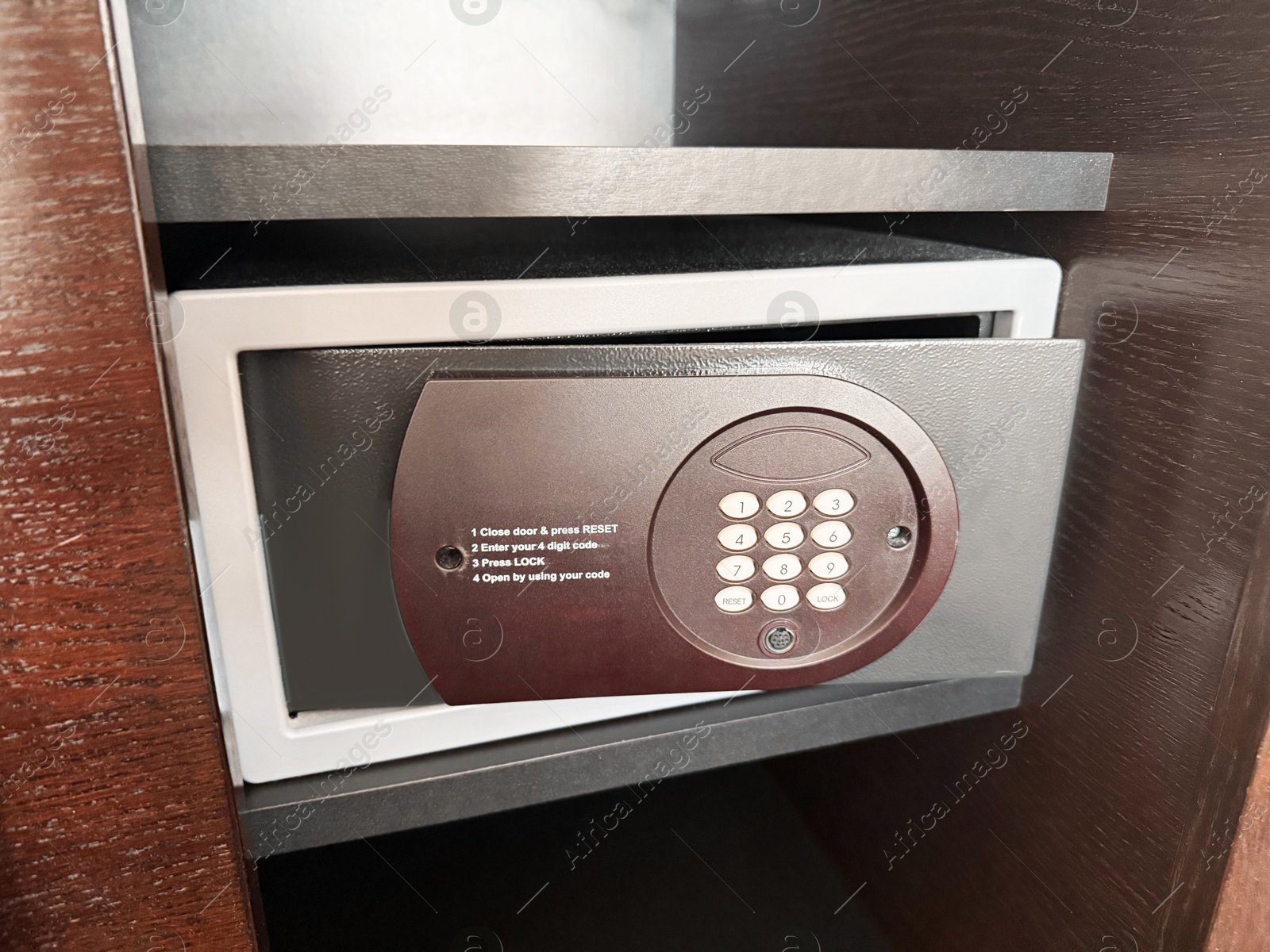 Steel safe with electronic lock indoors, closeup Photo of Steel safe with electronic lock indoors, closeup