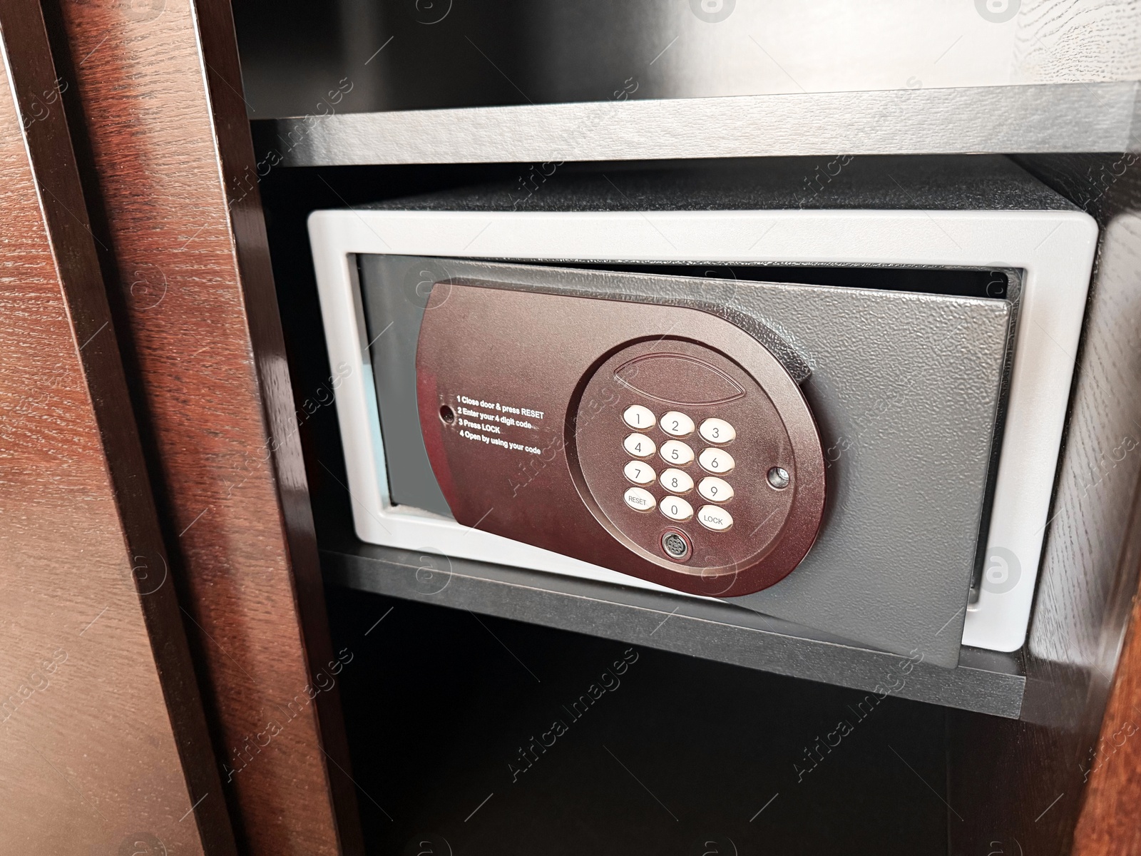 Steel safe with electronic lock indoors, closeup Photo of Steel safe with electronic lock indoors, closeup