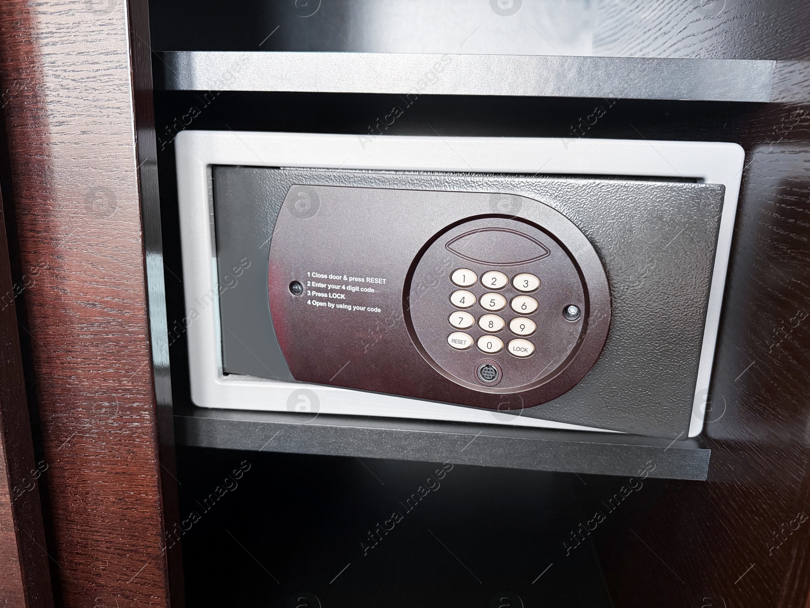 Steel safe with electronic lock indoors, closeup Photo of Steel safe with electronic lock indoors, closeup