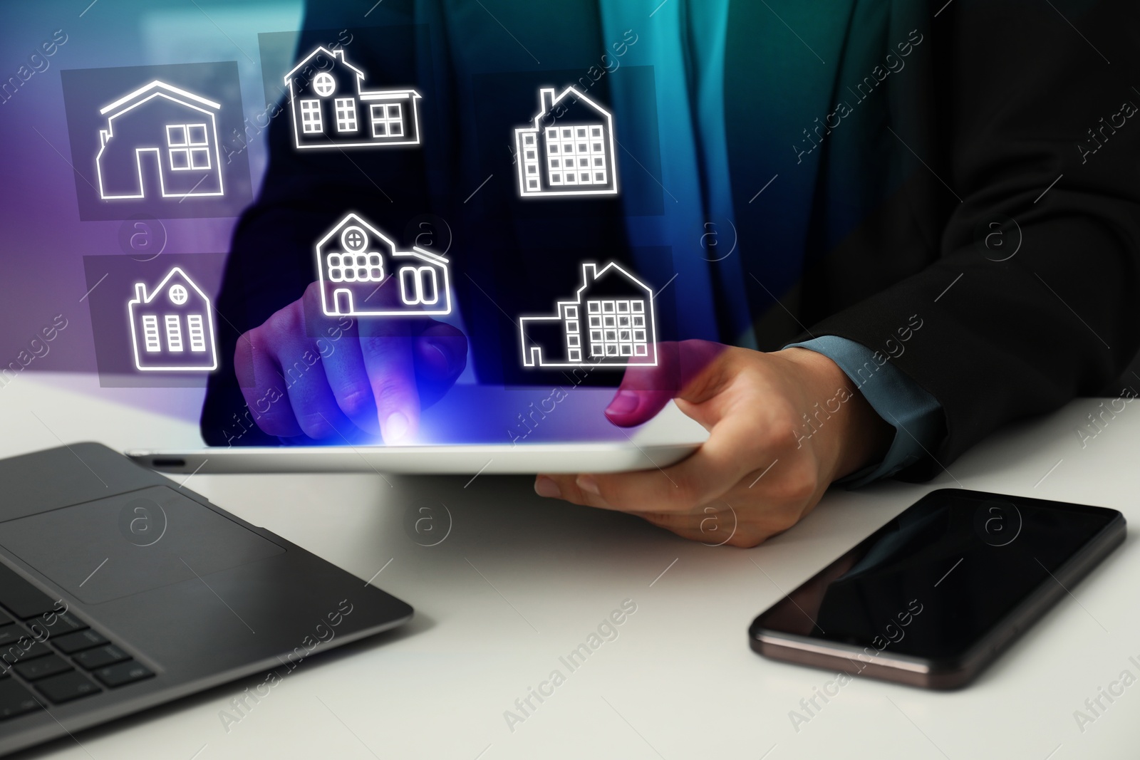 Real estate agent looking for housing via tablet at white table, closeup. Illustrations of different buildings over device Image of Real estate agent looking for housing via tablet at white table, closeup. Illustrations of different buildings over device