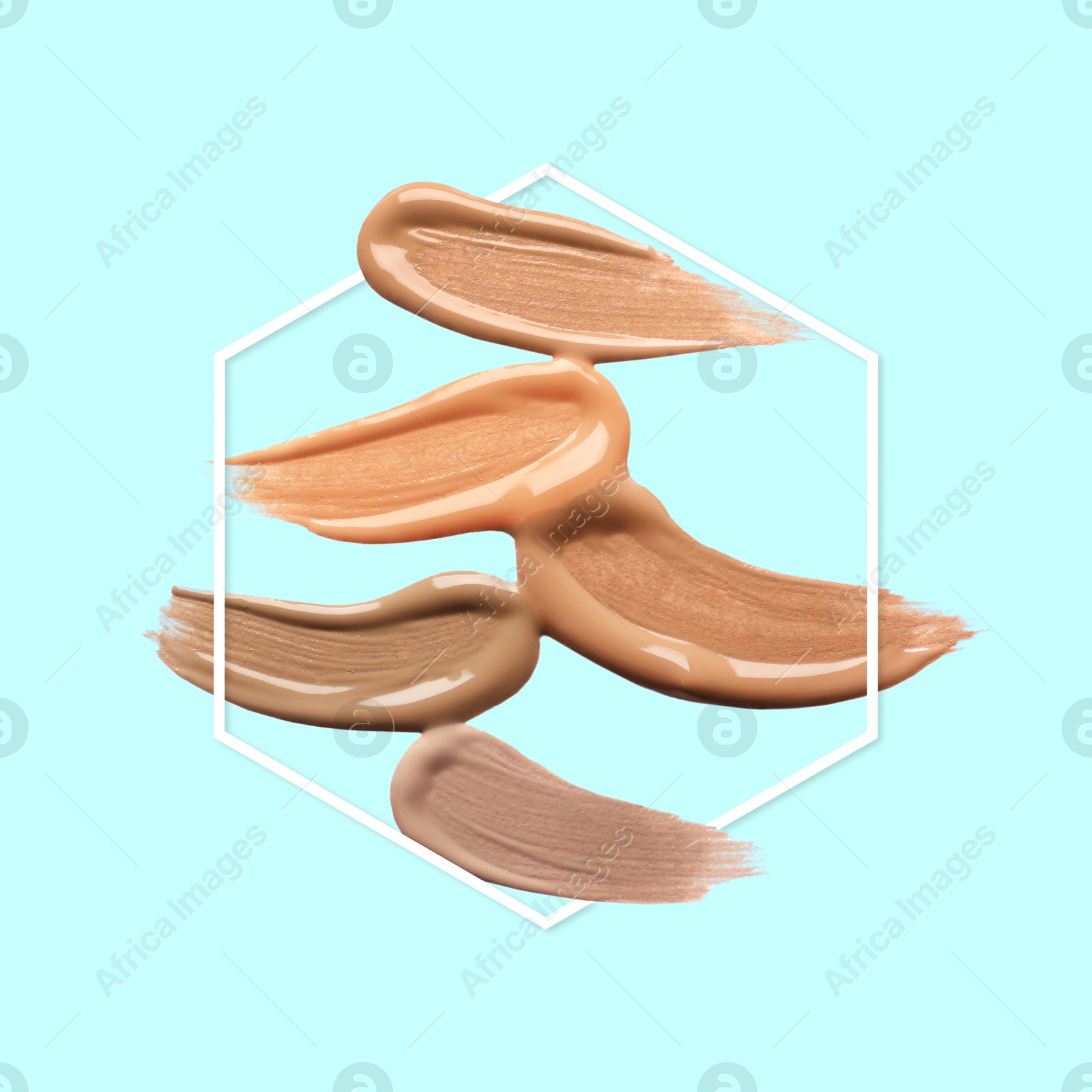Image of Different shades of foundation and frame on light blue background. Color palette of makeup product