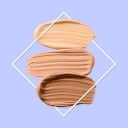 Image of Different shades of foundation and frame on pastel blue background. Color palette of makeup product