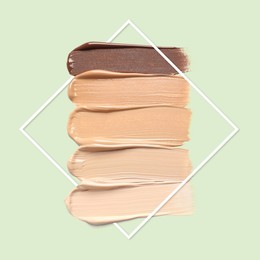 Image of Different shades of foundation and frame on pastel green background. Color palette of makeup product