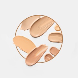 Image of Different shades of foundation and frame on white background. Color palette of makeup product