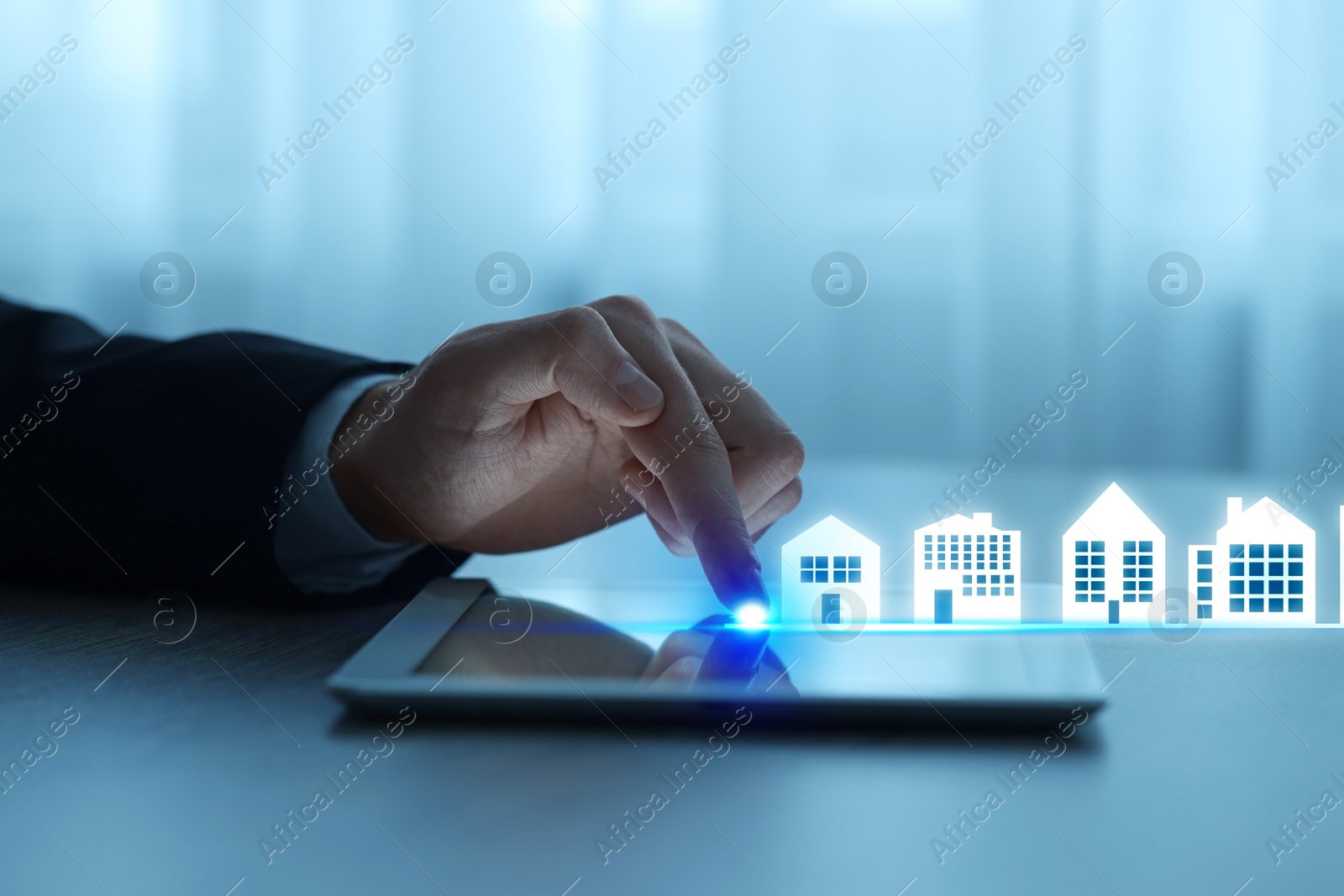 Real estate agent looking for housing via tablet at table, closeup. Different buildings icons on device screen Image of Real estate agent looking for housing via tablet at table, closeup. Different buildings icons on device screen