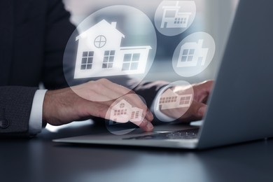 Image of Real estate agent looking for housing via laptop at table, closeup. Illustrations of different buildings over device
