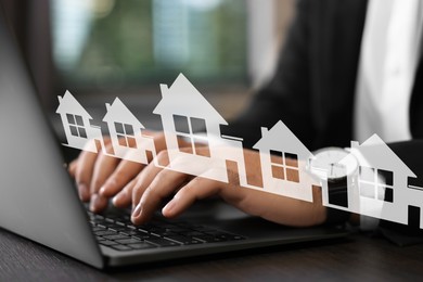 Image of Real estate agent looking for housing via laptop at table indoors, closeup. Illustrations of different buildings over device