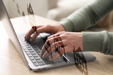 Image of Real estate agent looking for housing via laptop at wooden table, closeup. Illustrations of different dwellings over device