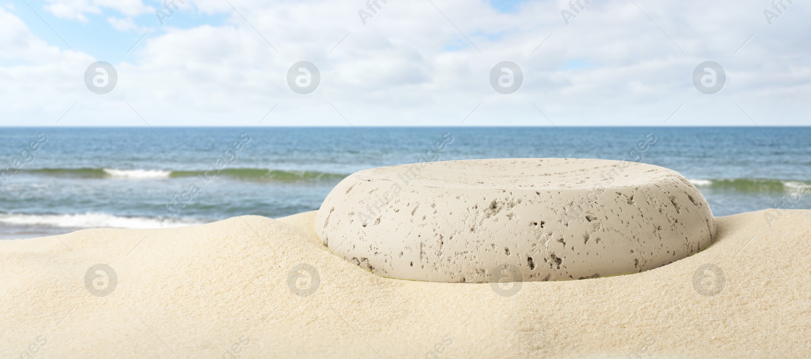 Podium for product promotion on sand near blue sea, banner design. Stylish presentation Image of Podium for product promotion on sand near blue sea, banner design. Stylish presentation