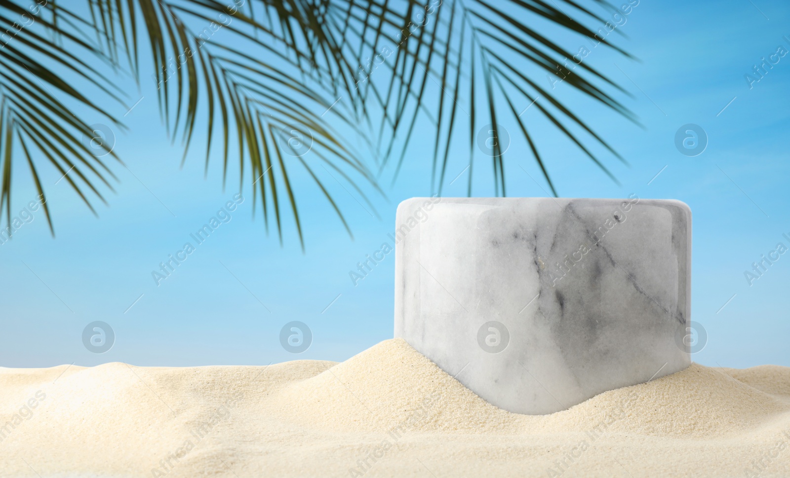 Podium for product promotion on sand under green palm leaves, banner design. Stylish presentation Image of Podium for product promotion on sand under green palm leaves, banner design. Stylish presentation