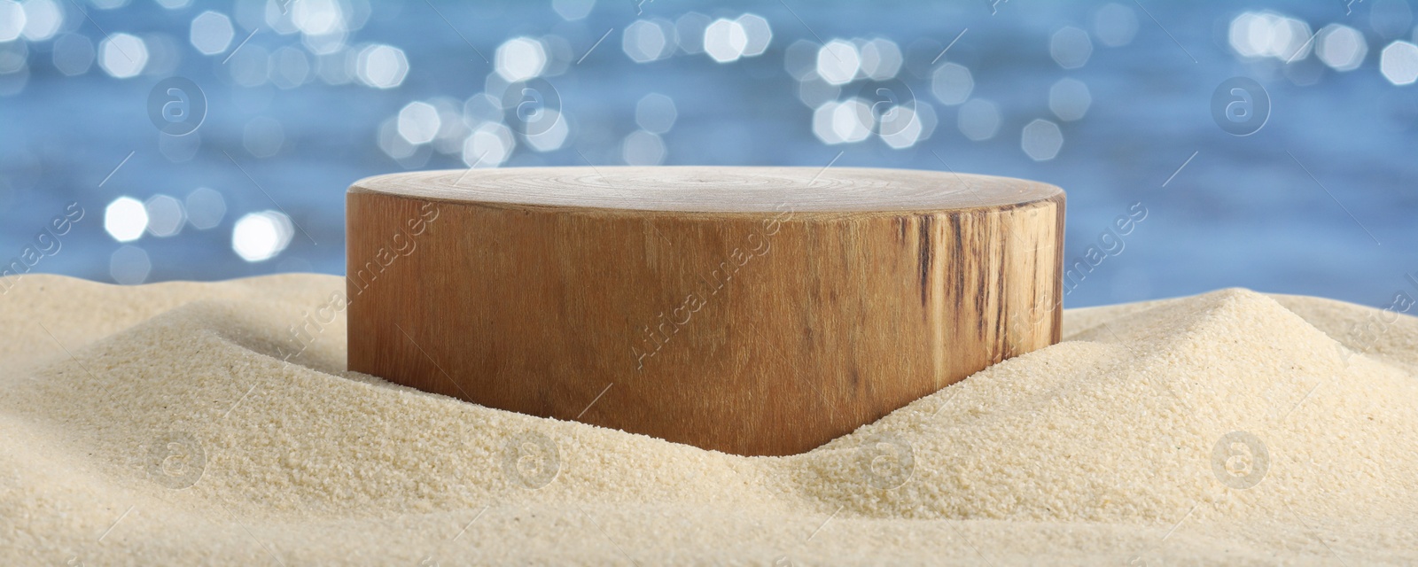 Podium for product promotion on sand near blue sea, banner design. Stylish presentation Image of Podium for product promotion on sand near blue sea, banner design. Stylish presentation