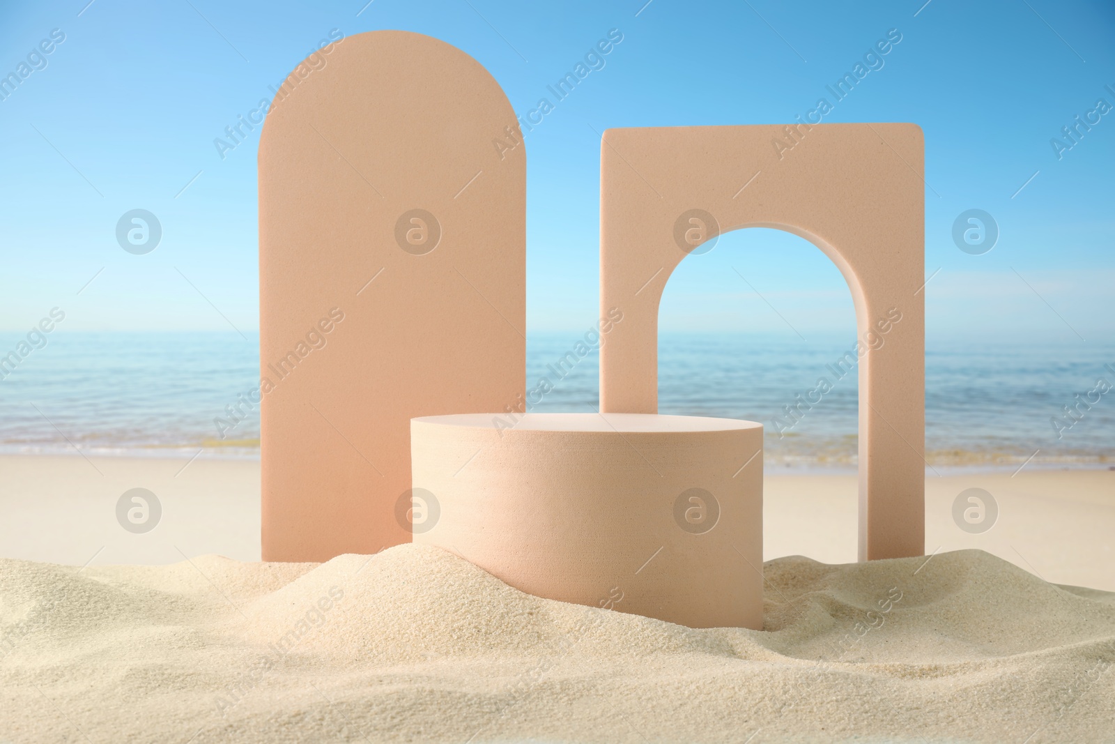 Podium for product presentation. Figures on sand near blue sea. Stylish promotion poster Image of Podium for product presentation. Figures on sand near blue sea. Stylish promotion poster
