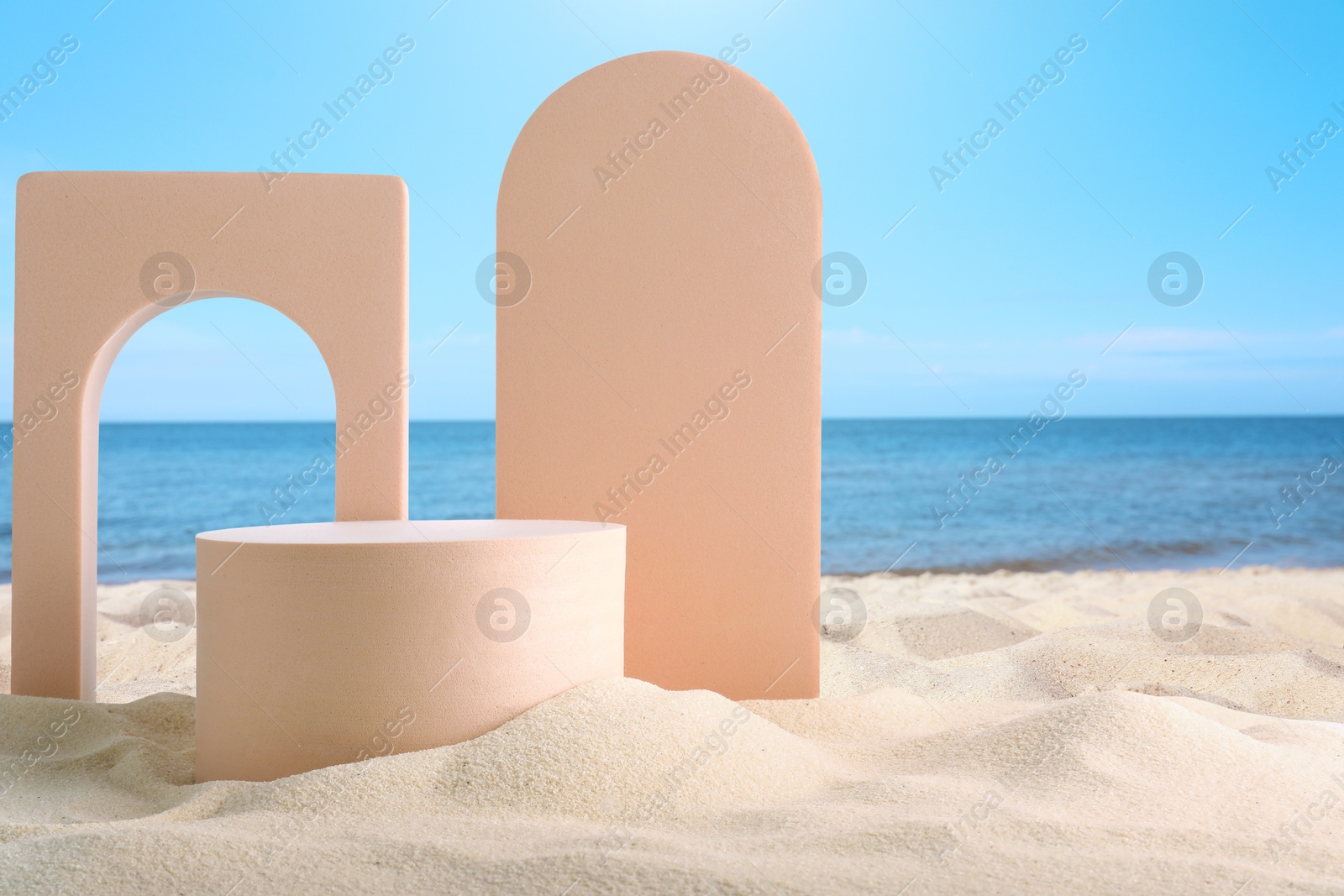 Podium for product presentation. Figures on sand near blue sea. Stylish promotion poster Image of Podium for product presentation. Figures on sand near blue sea. Stylish promotion poster