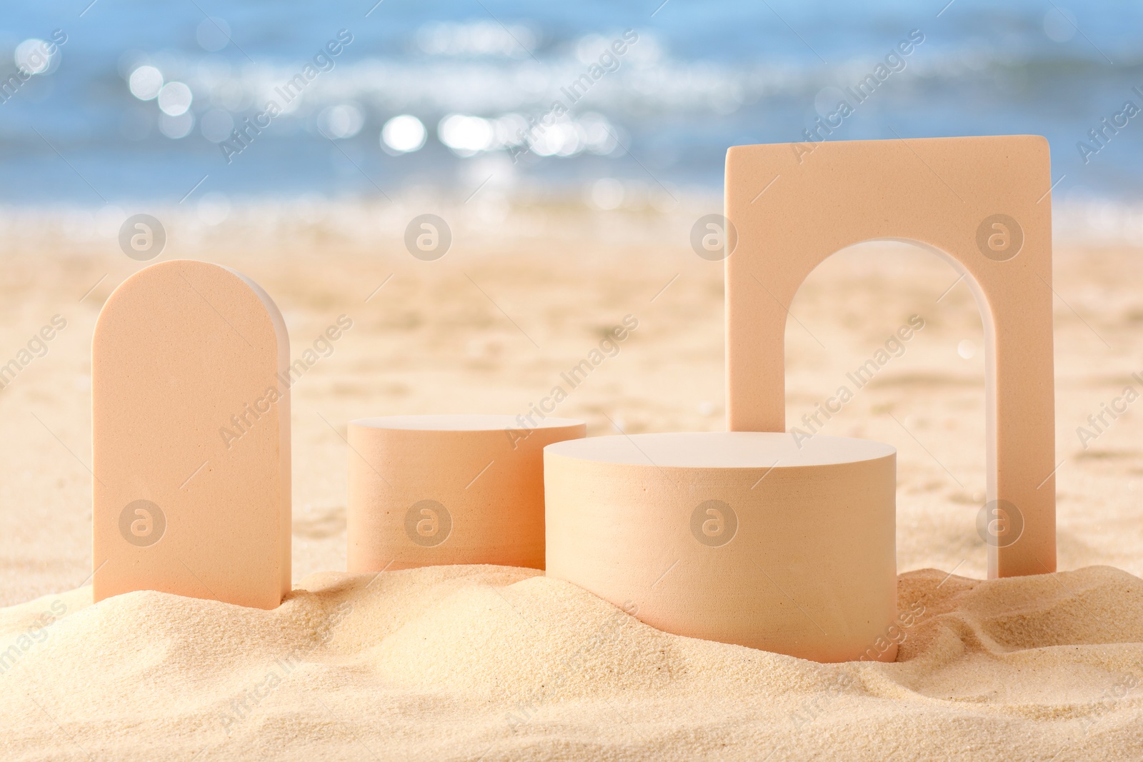 Podium for product presentation. Figures on sand near blue sea. Stylish promotion poster Image of Podium for product presentation. Figures on sand near blue sea. Stylish promotion poster