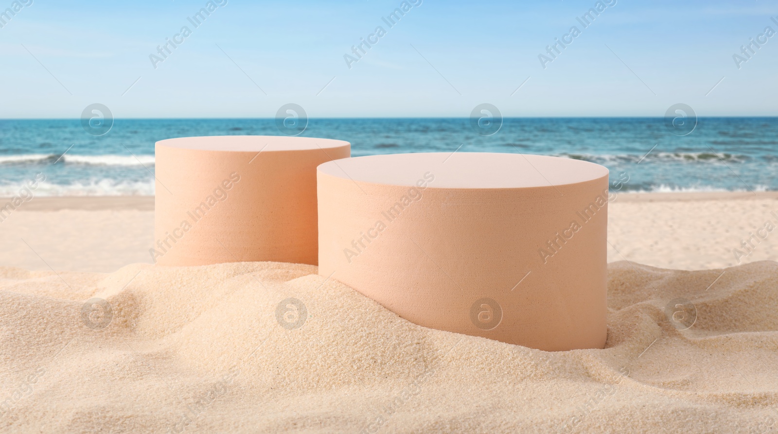 Podium for product presentation. Figures on sand near blue sea, banner design. Stylish promotion poster Image of Podium for product presentation. Figures on sand near blue sea, banner design. Stylish promotion poster