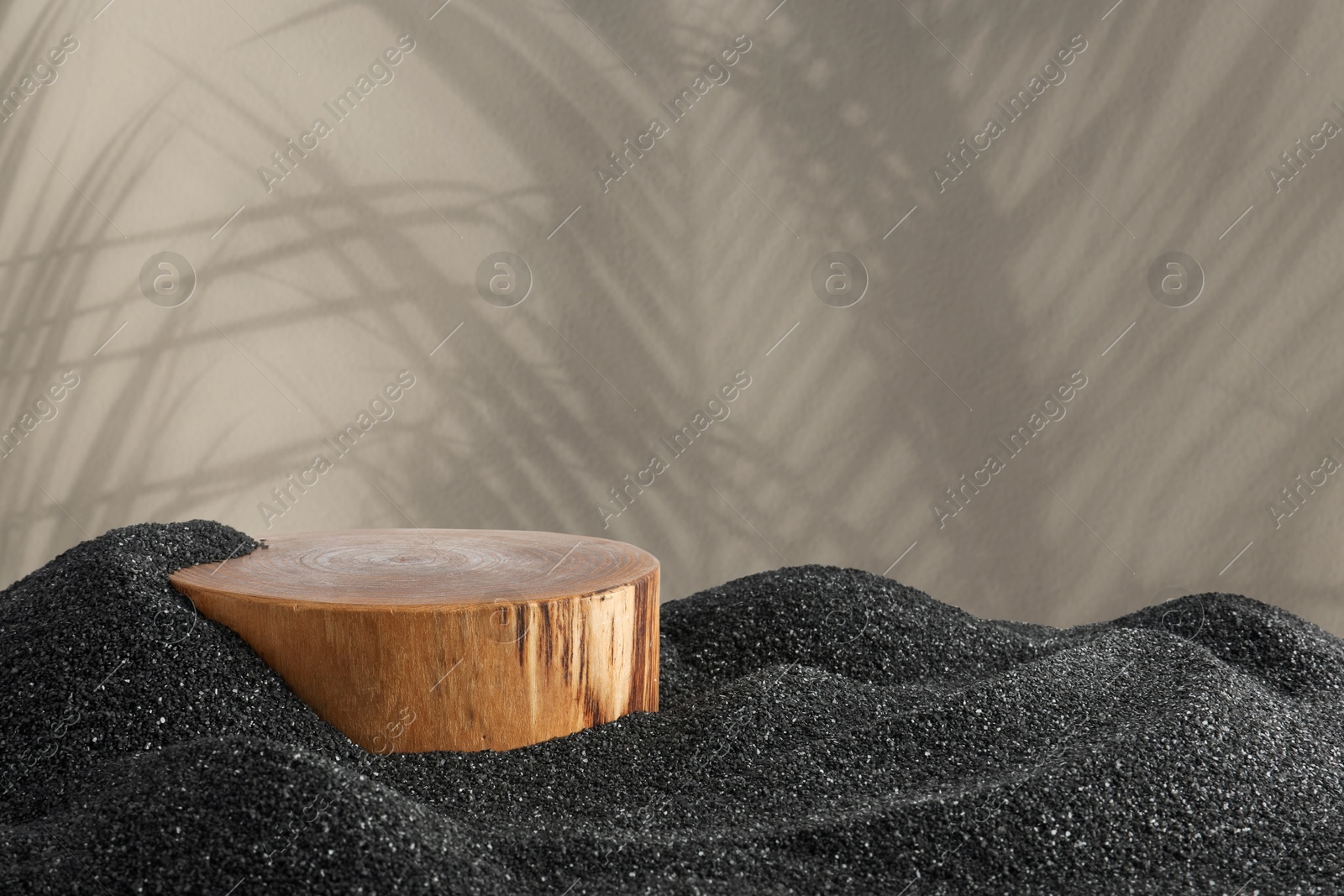 Podium for product presentation on black sand against beige background with shadow. Stylish promotion poster Image of Podium for product presentation on black sand against beige background with shadow. Stylish promotion poster