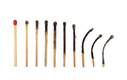 Image of Burnt matches and whole one on white background