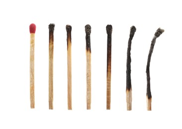 Image of Burnt matches and whole one on white background