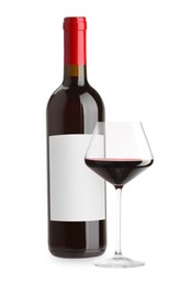Image of Luxurious red wine in bottle with blank label and glass isolated on white
