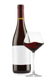 Image of Luxurious red wine in bottle with blank label and glass isolated on white