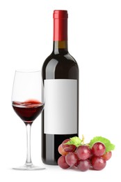 Image of Luxurious red wine in bottle with blank label, glass and grapes isolated on white