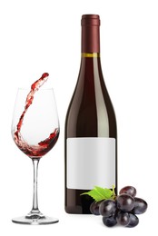 Image of Luxurious red wine in bottle with blank label, glass and grapes isolated on white