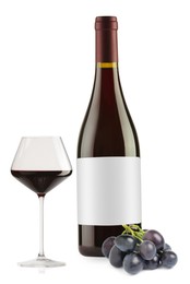 Image of Luxurious red wine in bottle with blank label, glass and grapes isolated on white