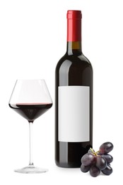 Image of Luxurious red wine in bottle with blank label, glass and grapes isolated on white