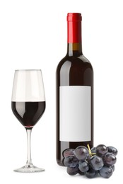 Image of Luxurious red wine in bottle with blank label, glass and grapes isolated on white