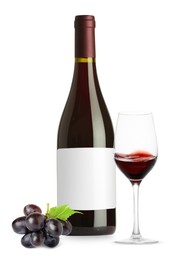Image of Luxurious red wine in bottle with blank label, glass and grapes isolated on white