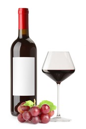 Image of Luxurious red wine in bottle with blank label, glass and grapes isolated on white