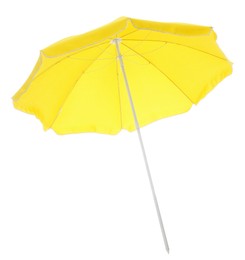 Photo of Open yellow beach umbrella isolated on white