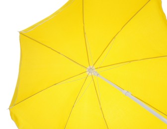 Photo of Open yellow beach umbrella isolated on white. Inner side