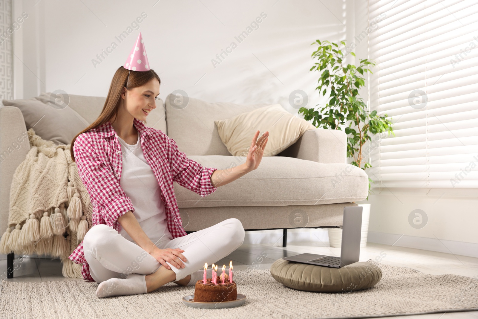 Birthday celebration. Happy woman with tasty cake having video call via laptop at home Photo of Birthday celebration. Happy woman with tasty cake having video call via laptop at home