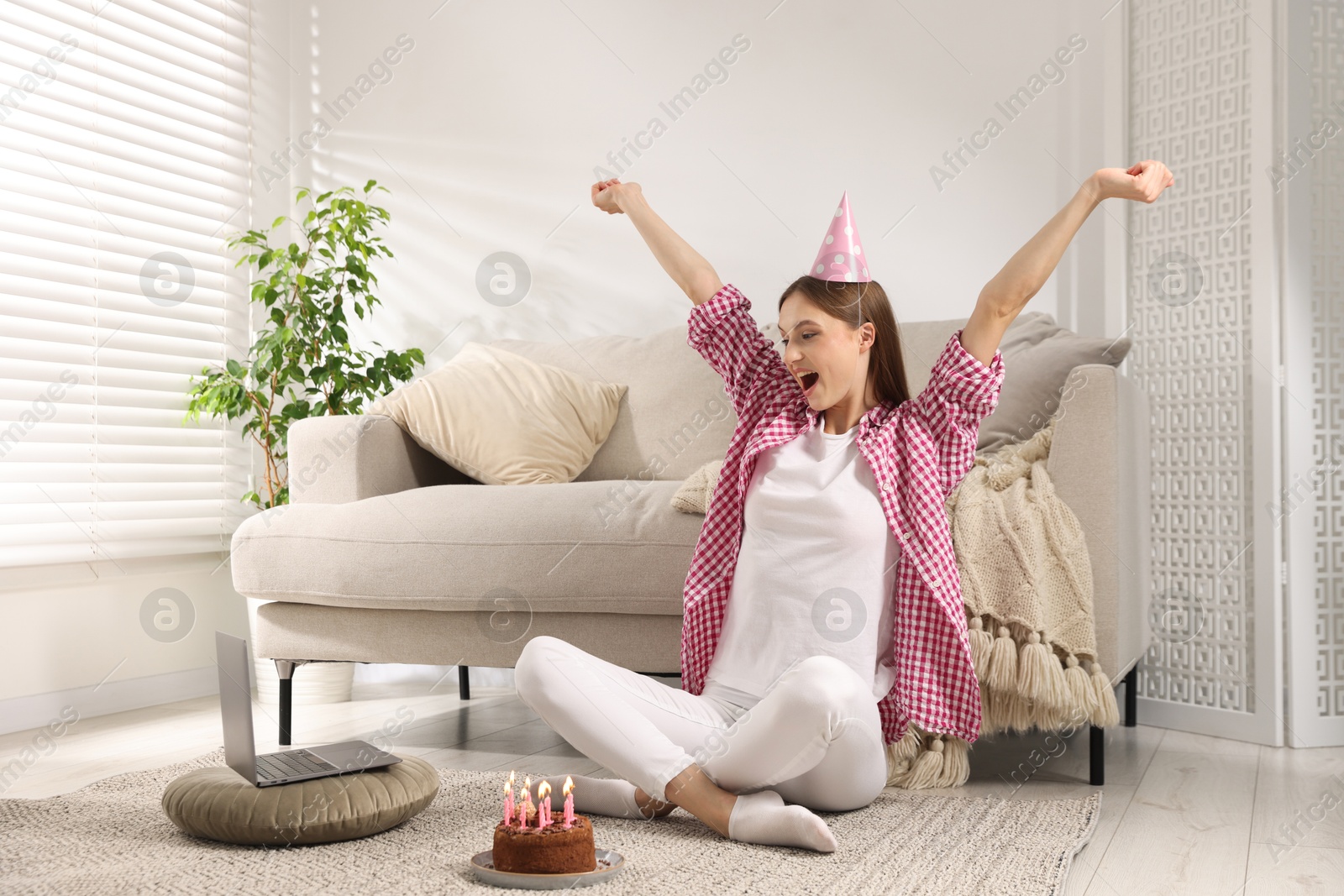 Birthday celebration. Happy woman with tasty cake having video call via laptop at home Photo of Birthday celebration. Happy woman with tasty cake having video call via laptop at home