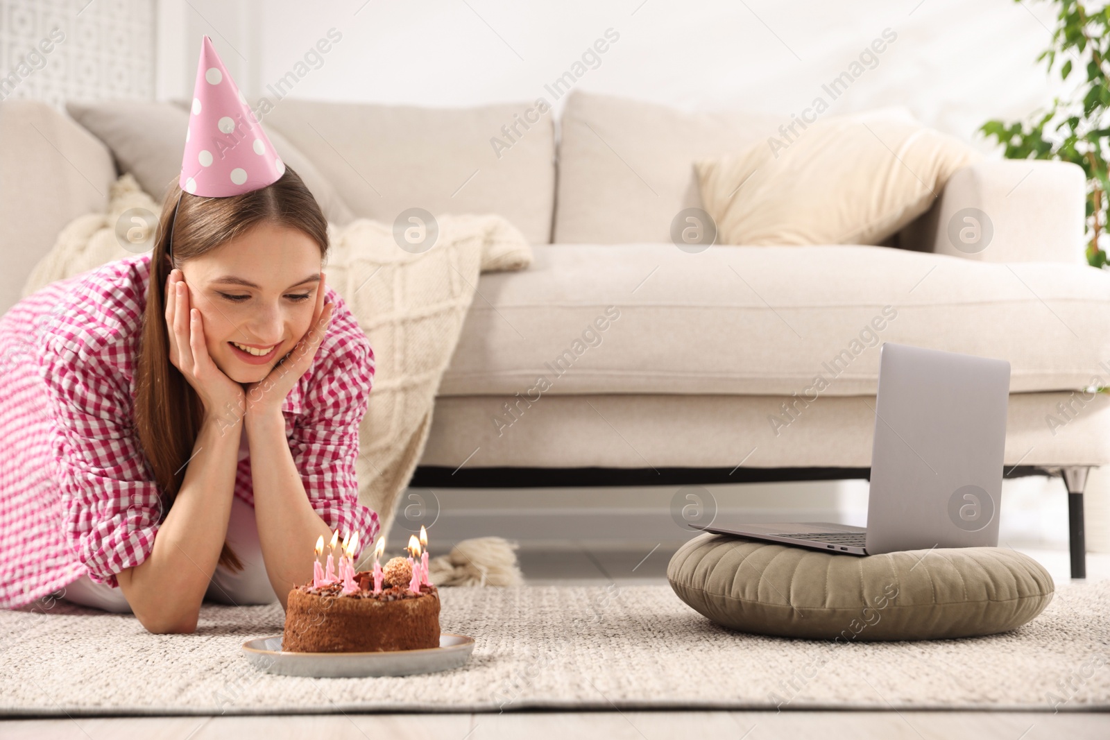 Birthday celebration. Happy woman with tasty cake having video call via laptop at home Photo of Birthday celebration. Happy woman with tasty cake having video call via laptop at home