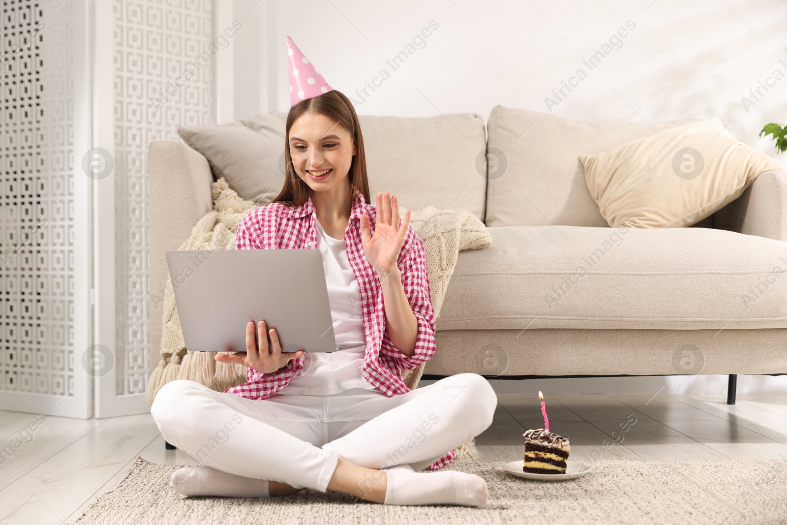 Birthday celebration. Happy woman having video call via laptop at home Photo of Birthday celebration. Happy woman having video call via laptop at home