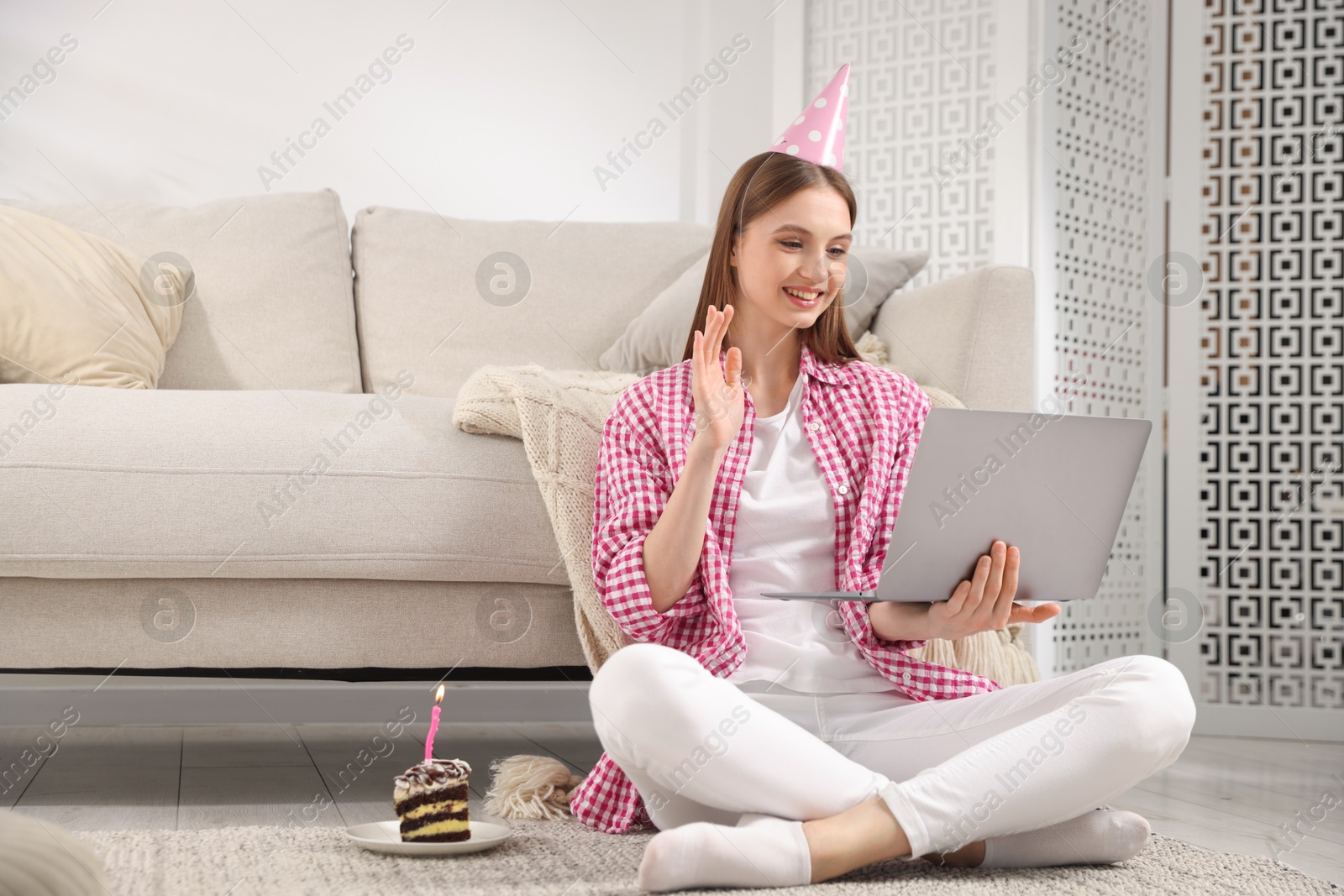 Birthday celebration. Happy woman having video call via laptop at home Photo of Birthday celebration. Happy woman having video call via laptop at home