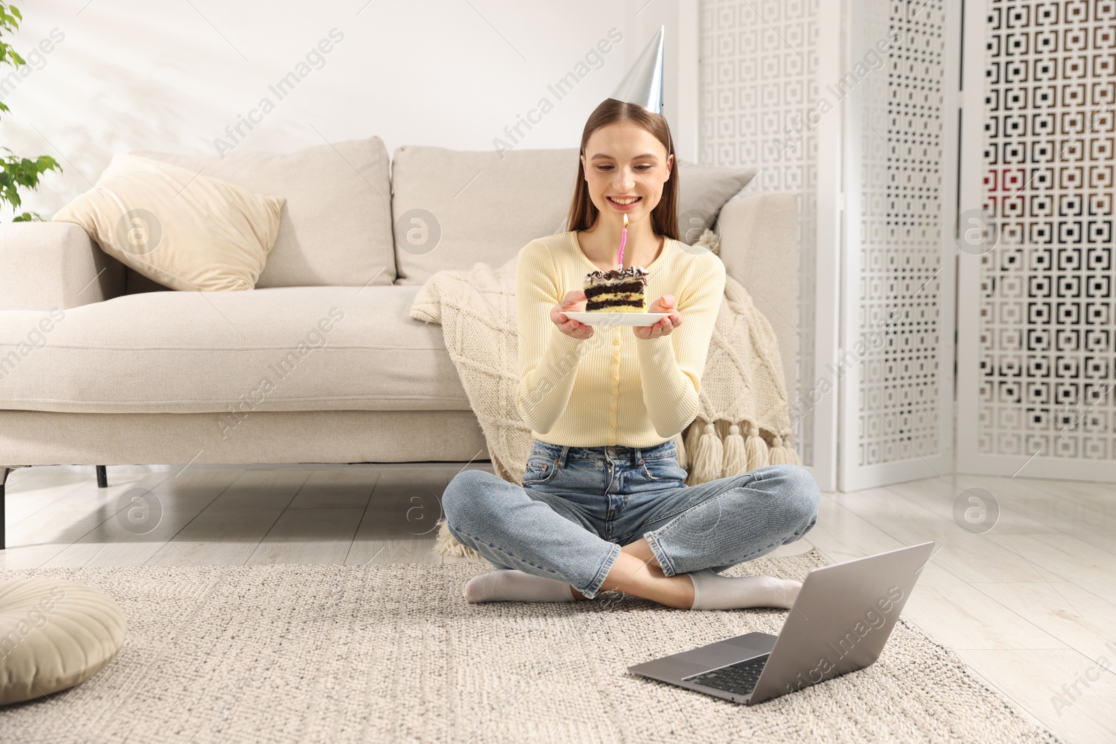 Birthday celebration. Happy woman with piece of cake having video call via laptop at home Photo of Birthday celebration. Happy woman with piece of cake having video call via laptop at home