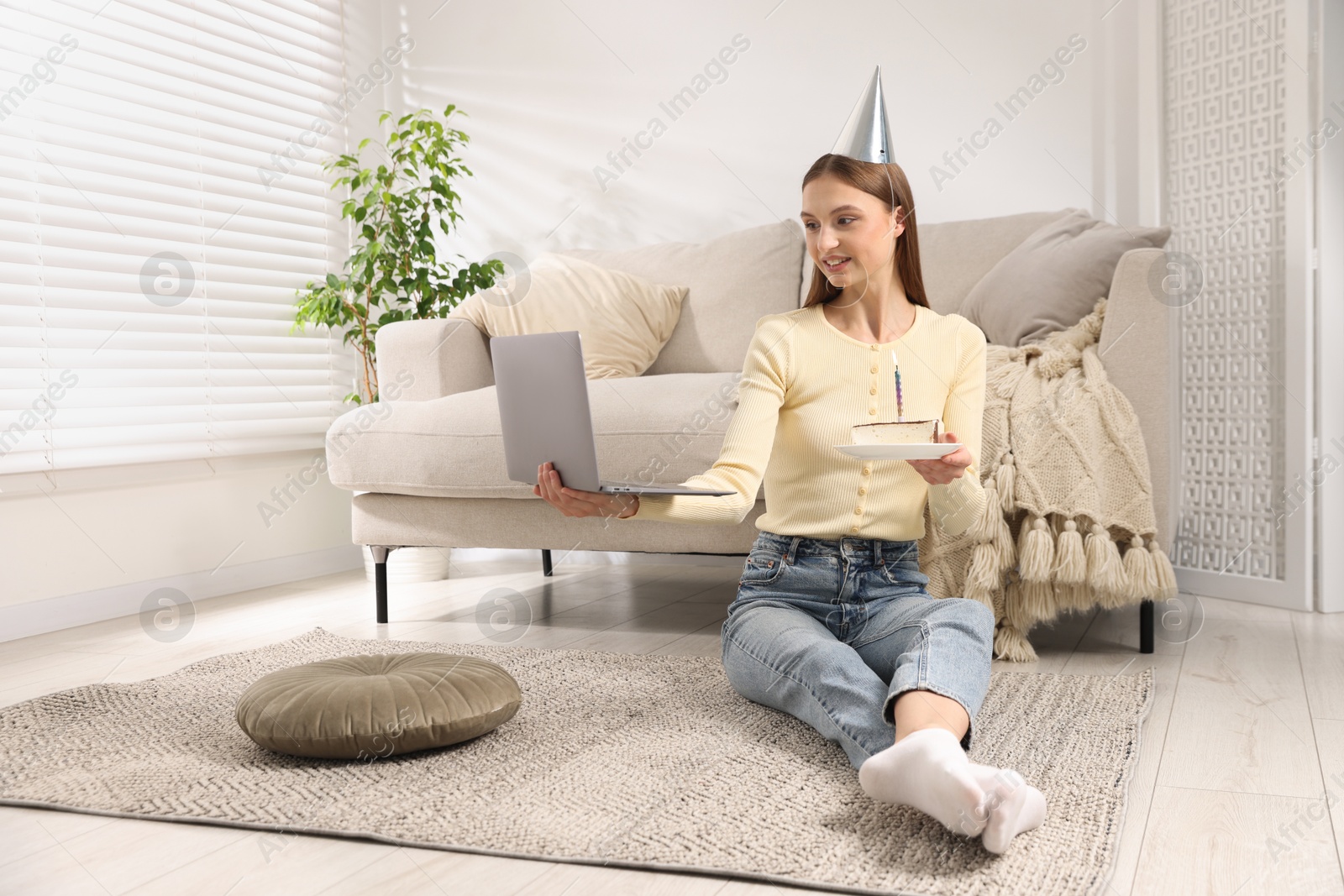 Birthday celebration. Happy woman with piece of cake having video call via laptop at home Photo of Birthday celebration. Happy woman with piece of cake having video call via laptop at home