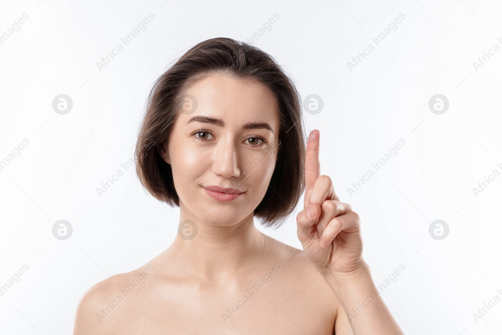 Woman with contact lens on white background Photo of Woman with contact lens on white background