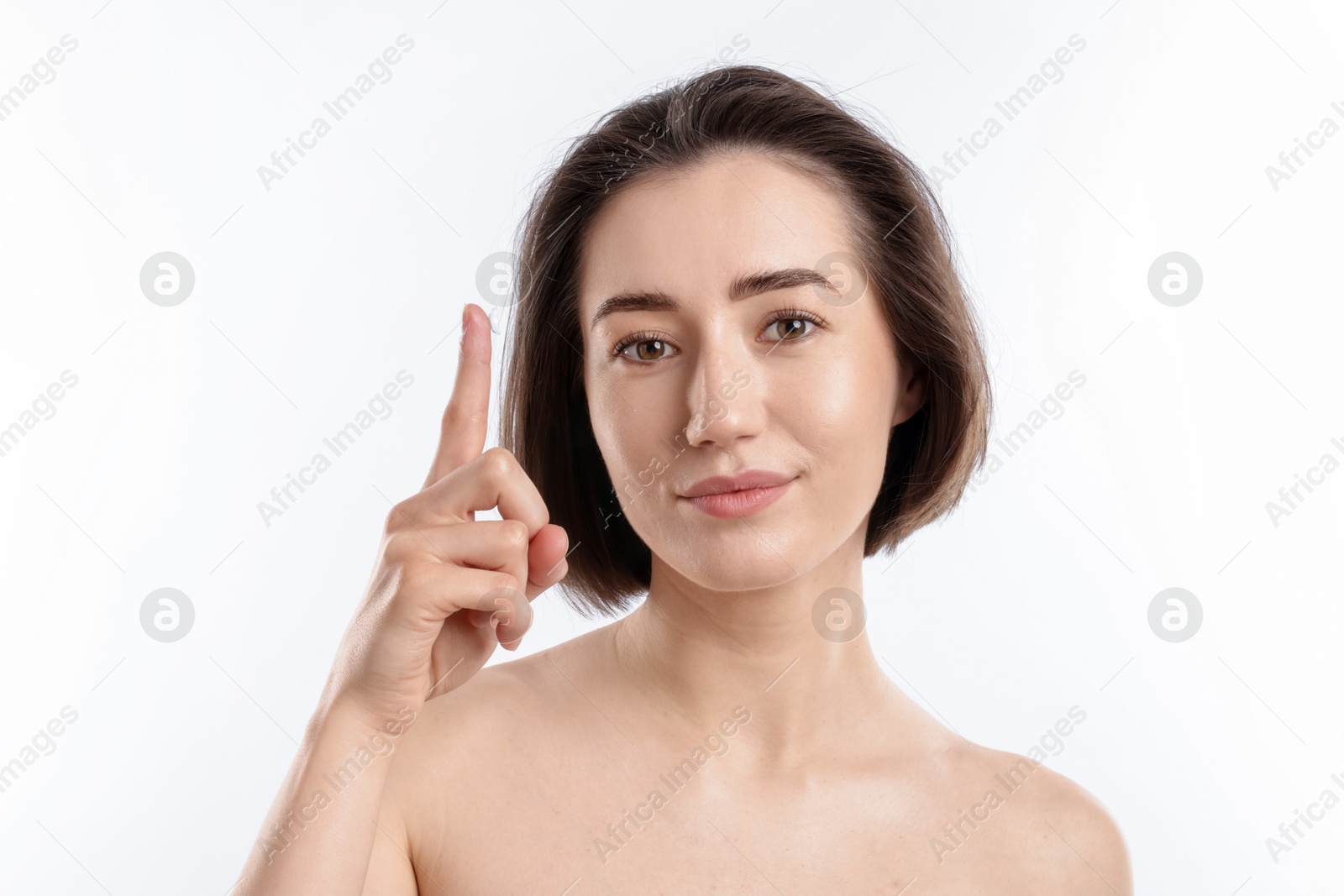 Woman with contact lens on white background Photo of Woman with contact lens on white background