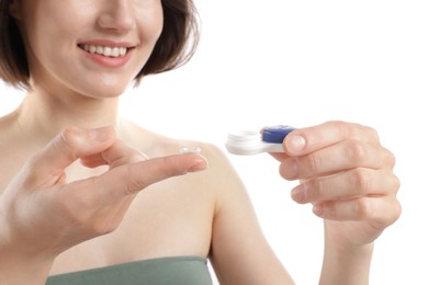 Photo of Woman with contact lens and case on white background, closeup