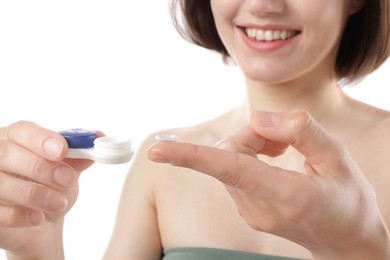 Photo of Woman with contact lens and case on white background, closeup