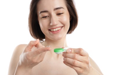 Photo of Woman with contact lens and case on white background, closeup